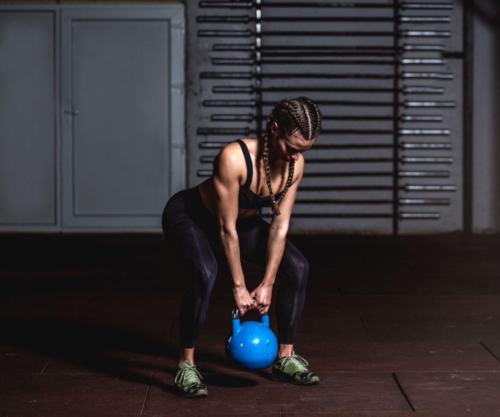 woman preparing for swing with kettlebell