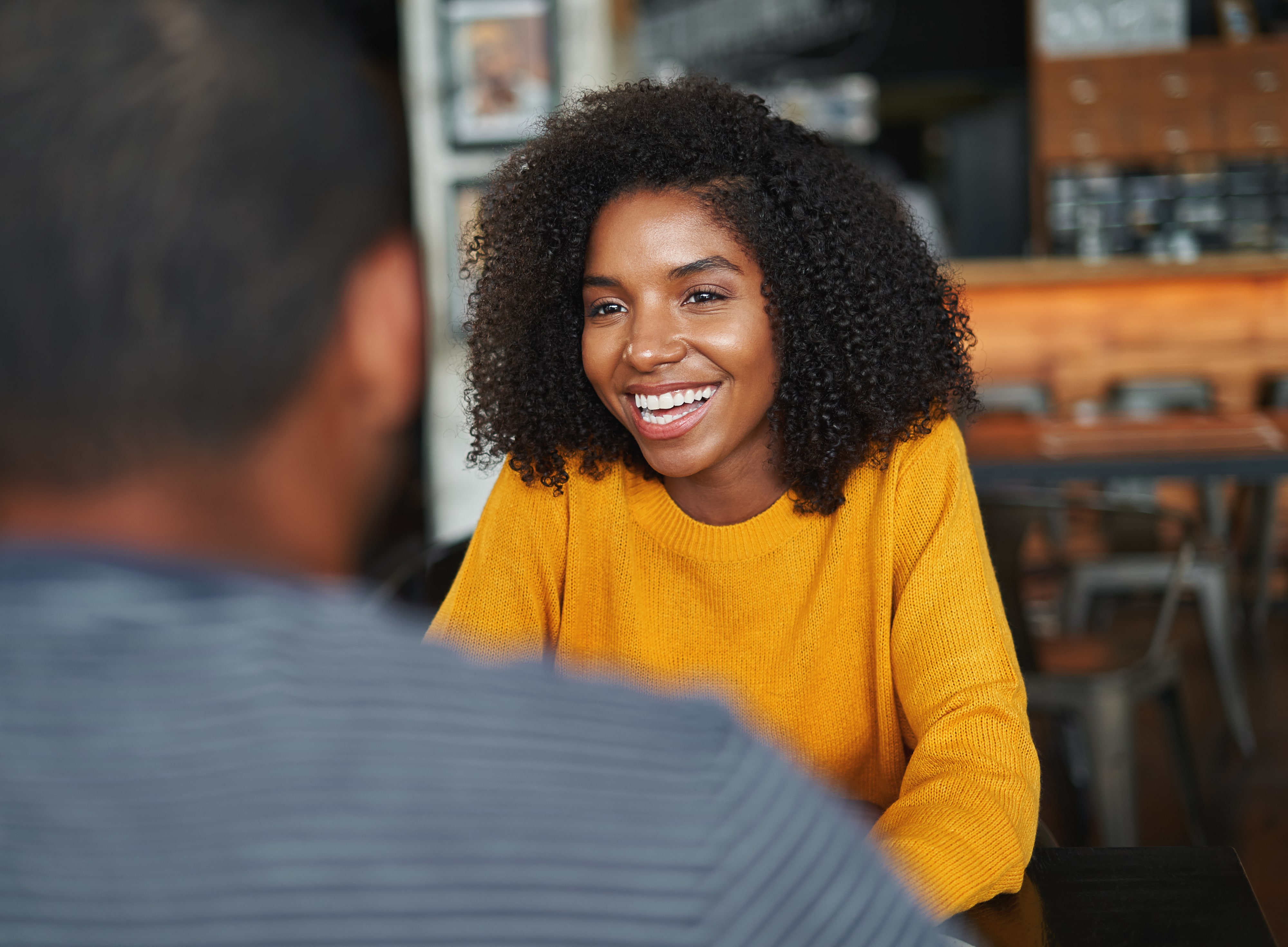 Woman sitting in cafe with client
